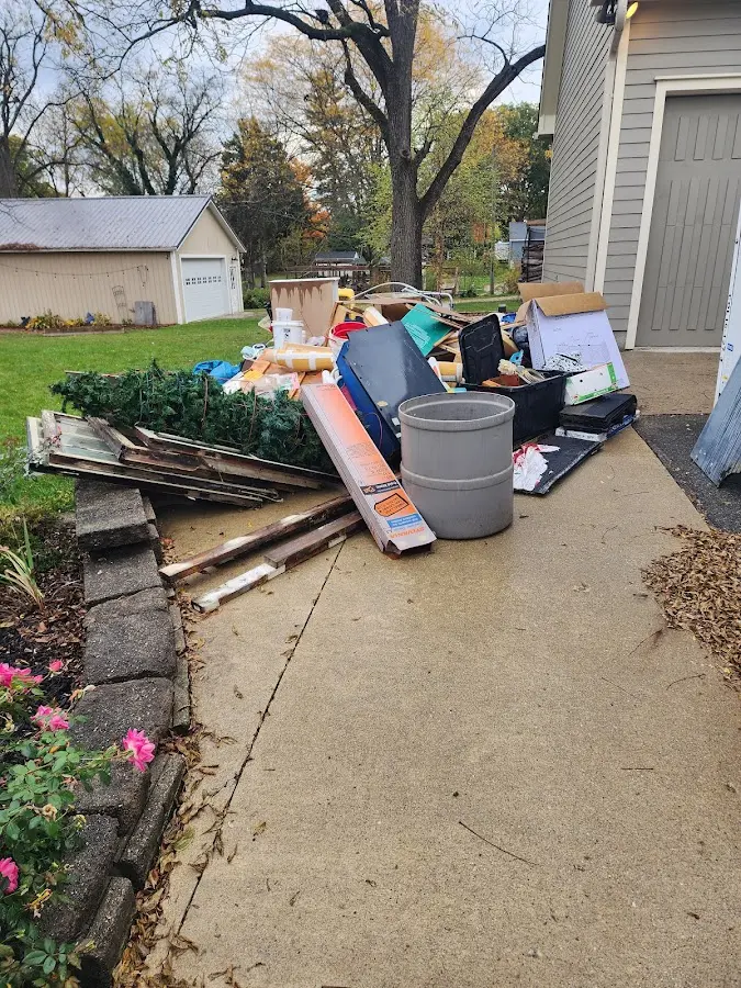 Dumpster being loaded with debris for 3 Yard Dumpster Rental in Ann Arbor